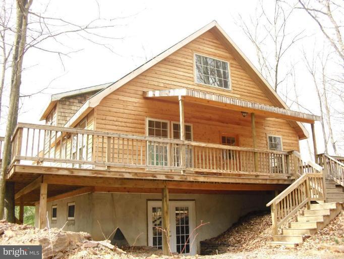 21 Riggs Lane Capon Bridge, WV 26711 - Photo 24 of 24 a front view of a house with a balcony