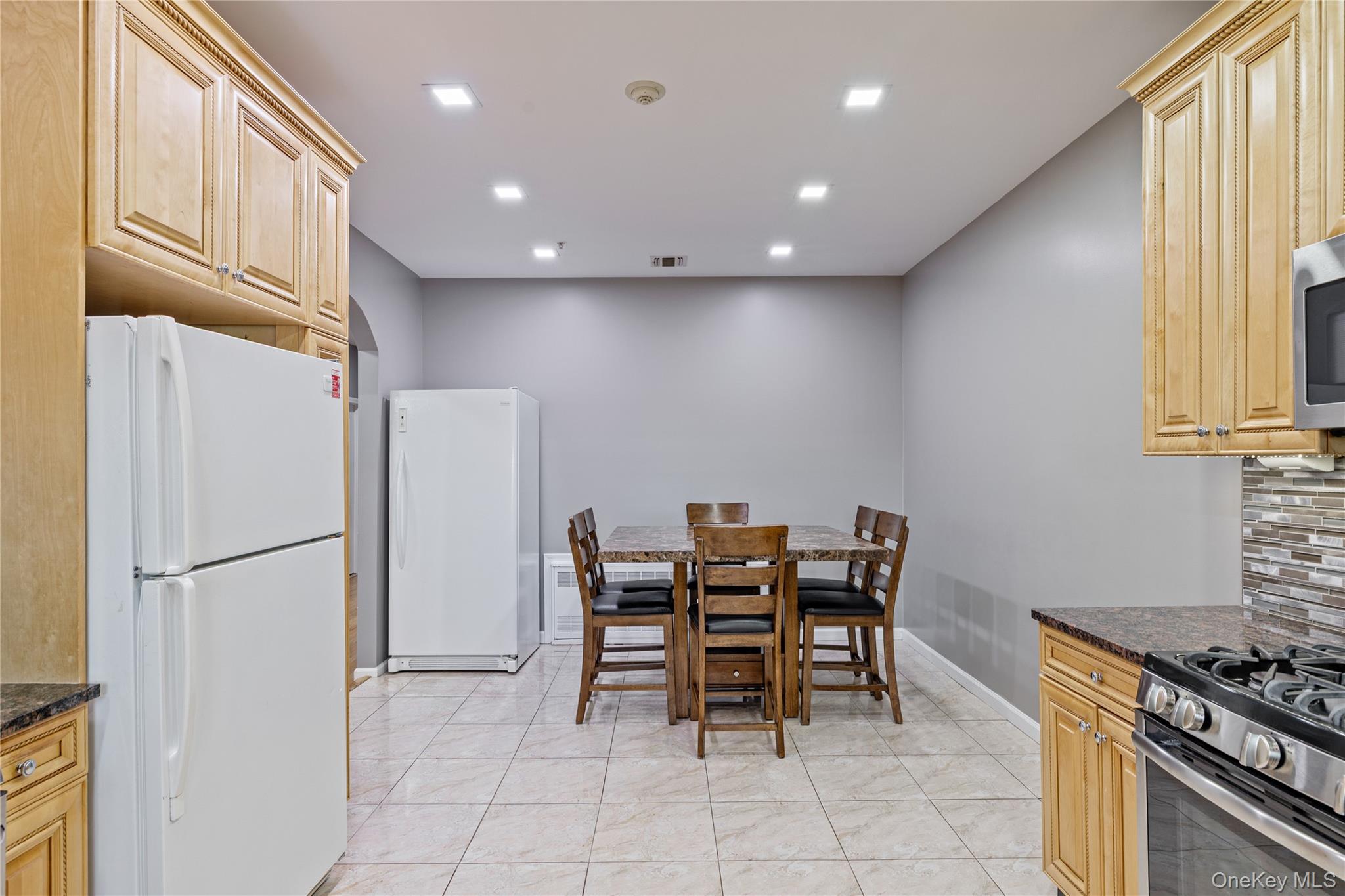 3314 Parkview Drive Spring Valley, NY 10977 - Photo 17 of 34 a kitchen with stainless steel appliances granite countertop a refrigerator and a stove top oven