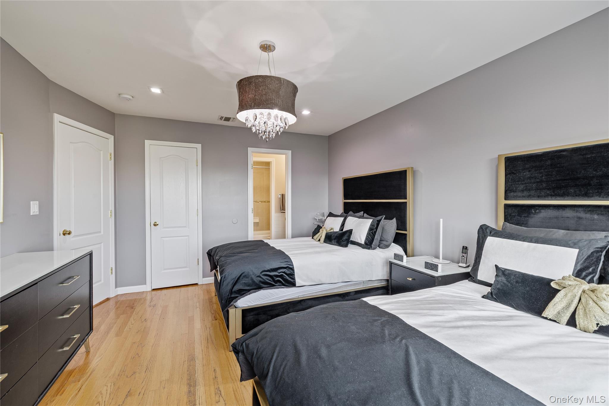 3314 Parkview Drive Spring Valley, NY 10977 - Photo 22 of 34 a bedroom with two beds and a chandelier