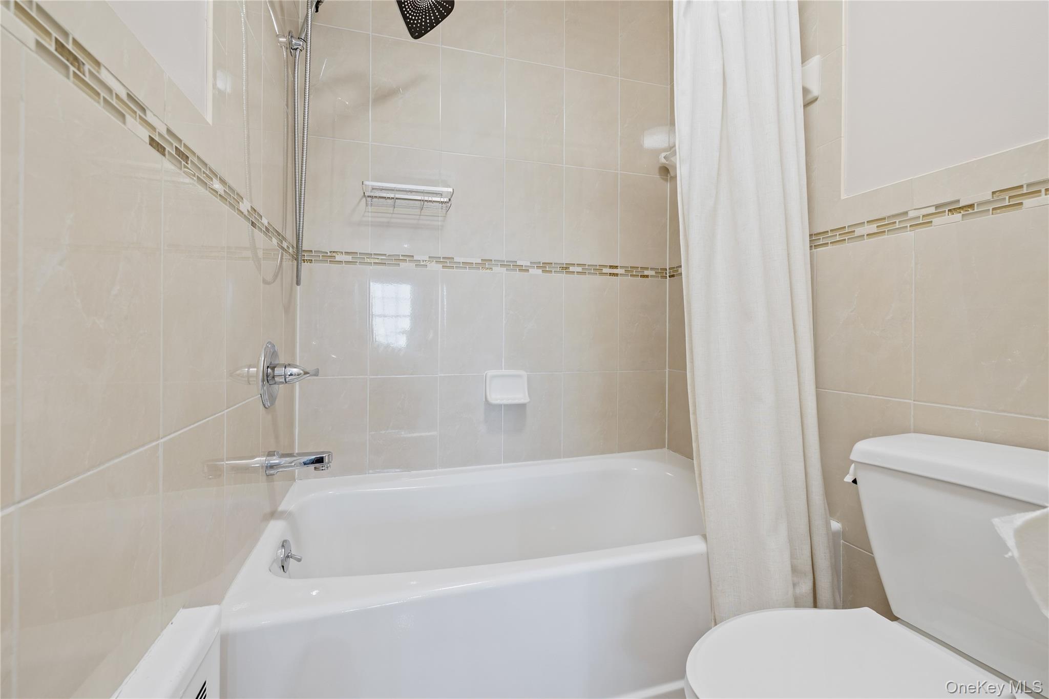 3314 Parkview Drive Spring Valley, NY 10977 - Photo 24 of 34 a white bath tub sitting next to a toilet