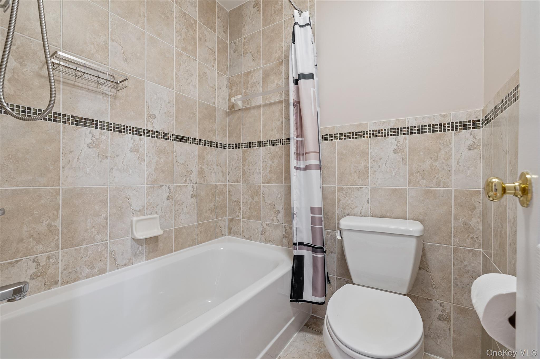 3314 Parkview Drive Spring Valley, NY 10977 - Photo 30 of 34 a white toilet sitting next to a bath tub and a shower