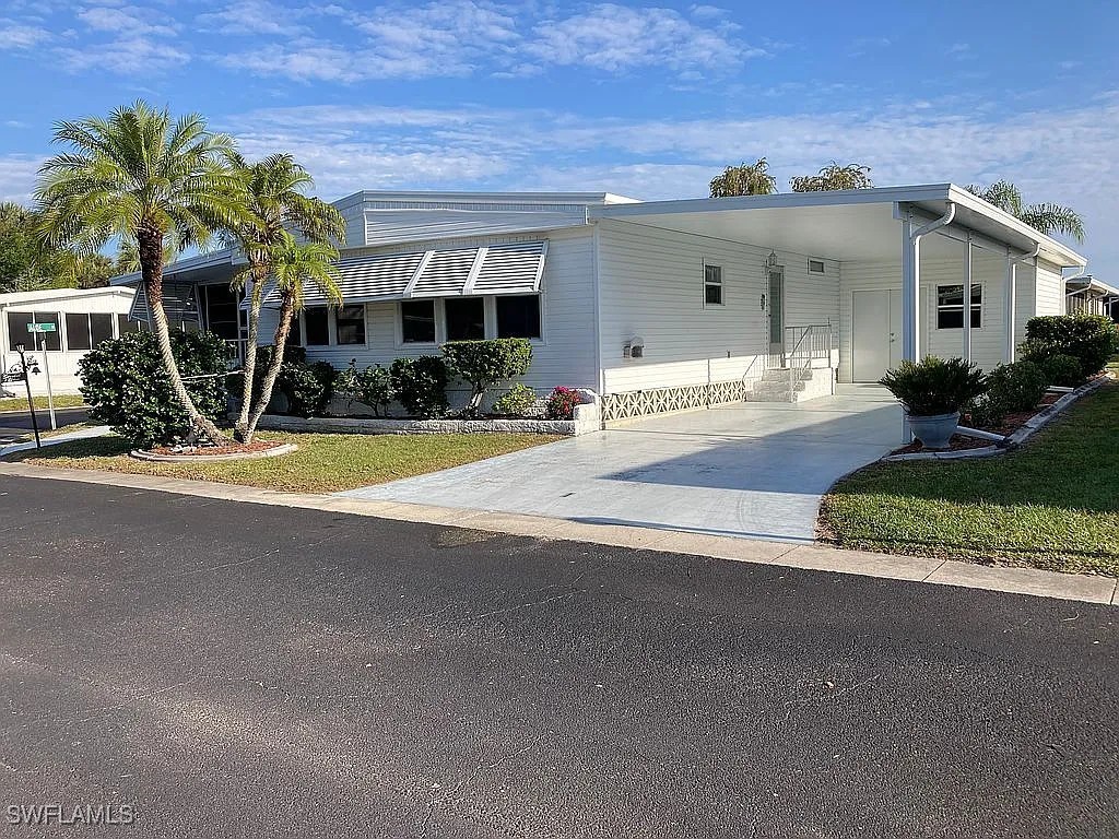 1 Elder Alva, FL 33920 - Photo 1 of 23 front view of a house with a yard