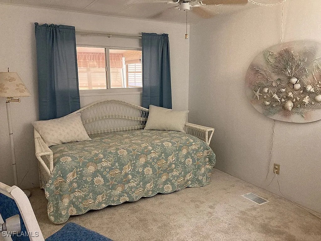 1 Elder Alva, FL 33920 - Photo 4 of 23 a bedroom with a bed and a painting on the wall