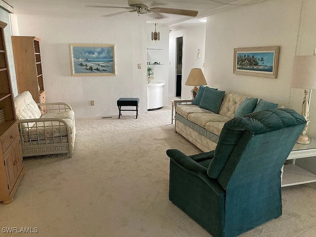 1 Elder Alva, FL 33920 - Photo 5 of 23 a living room with furniture and a flat screen tv