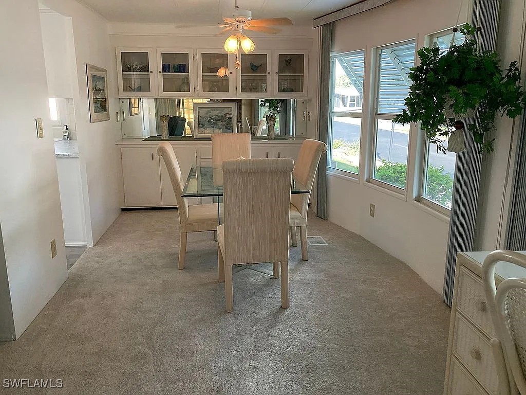 1 Elder Alva, FL 33920 - Photo 10 of 23 a view of a dining room with furniture window and wooden floor