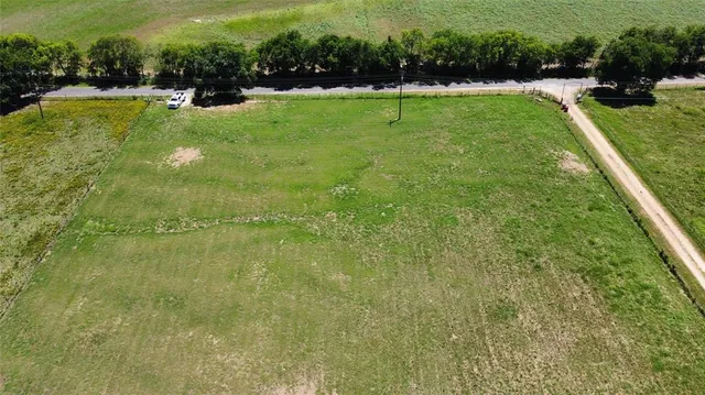a view of a swimming pool with a yard