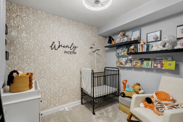 a bedroom with furniture and a shelf