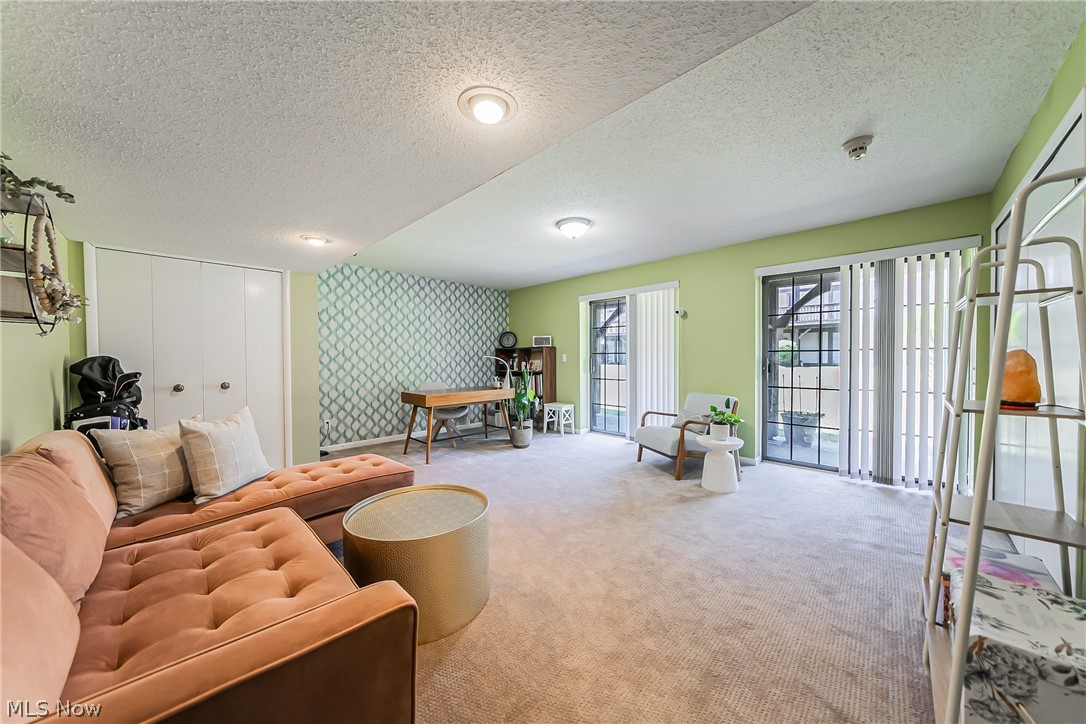 3510 Hampton Road Pepper Pike, OH 44122 - Photo 22 of 31 Carpeted living room featuring a textured ceiling