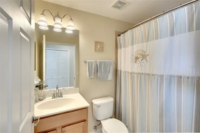 a living room with furniture and a large mirror