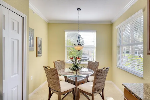 a dining room with furniture and window