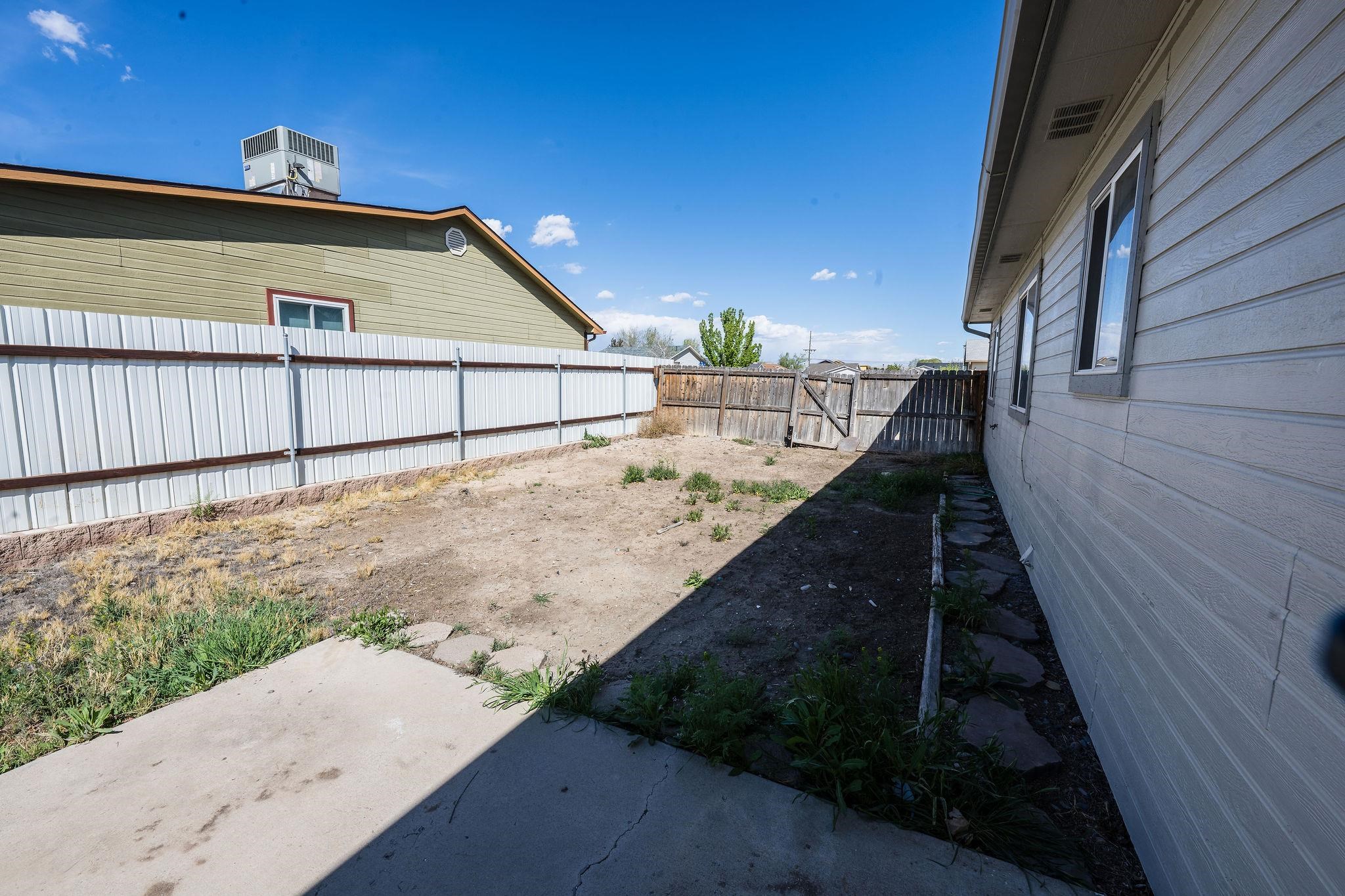 455 David Court Fruita, CO 81521 - Photo 16 of 28 a view of a house with a yard