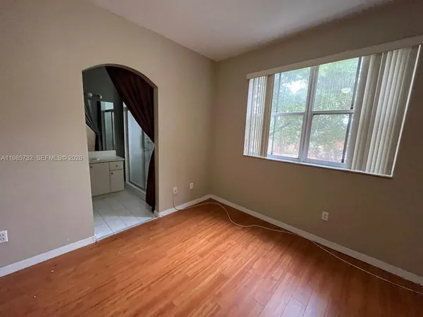 a view of a pathway with a buildings in the background