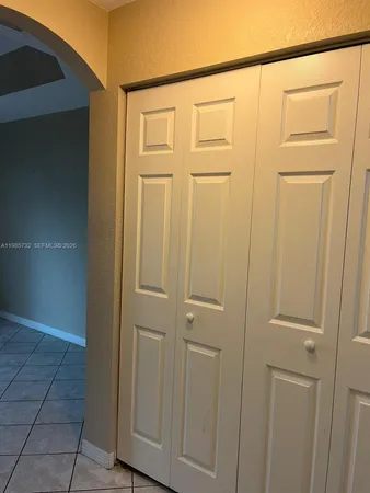 a view of a closet area with hallway