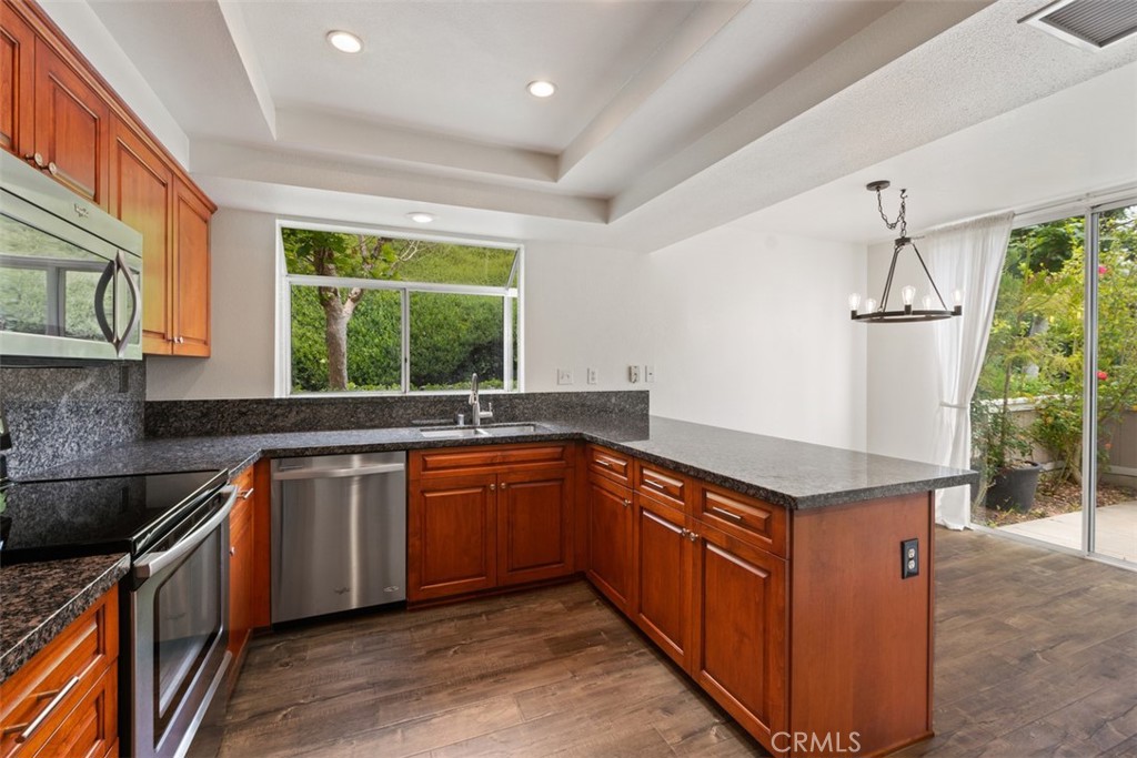14 Pickney Close Laguna Niguel, CA 92677 - Photo 17 of 22 a kitchen with stainless steel appliances granite countertop a sink and a stove