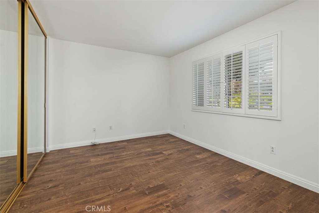 14 Pickney Close Laguna Niguel, CA 92677 - Photo 21 of 22 a view of an empty room with wooden floor and a window