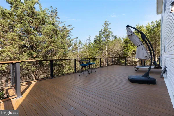 a view of a balcony with chairs