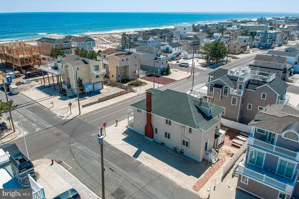 an aerial view of a city with ocean view