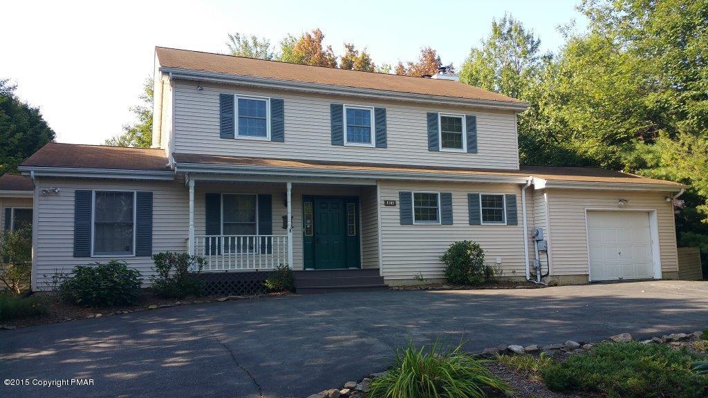 4161 Hickory Road Tobyhanna, PA 18466 - Photo 1 of 31 a front view of a house with garden