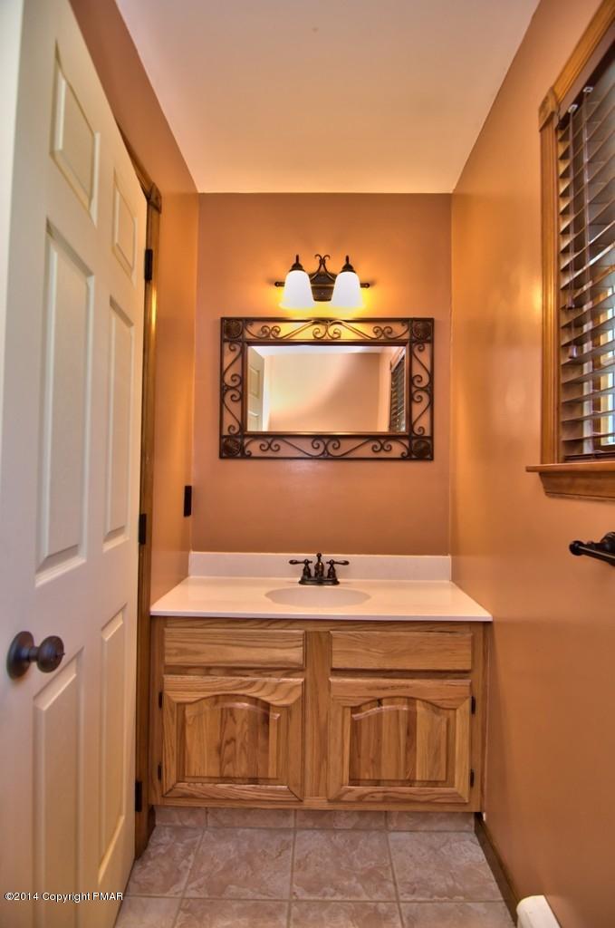 4161 Hickory Road Tobyhanna, PA 18466 - Photo 16 of 31 a bathroom with a sink and a mirror