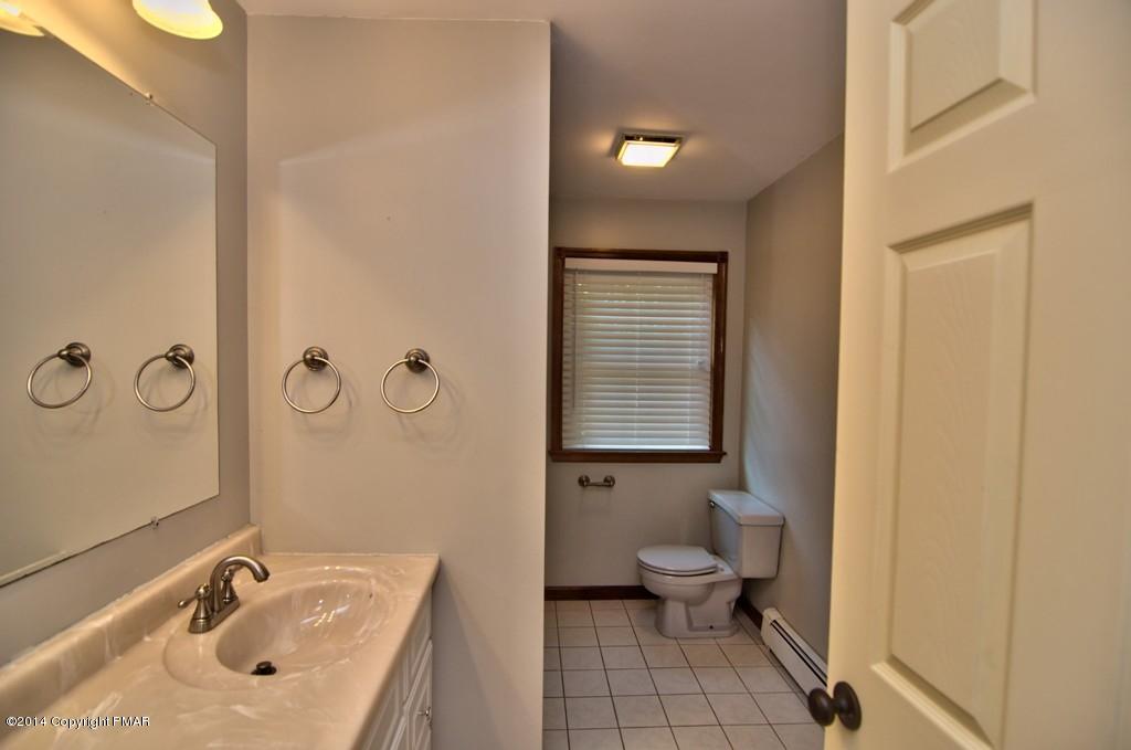 4161 Hickory Road Tobyhanna, PA 18466 - Photo 19 of 31 a bathroom with a sink toilet and shower