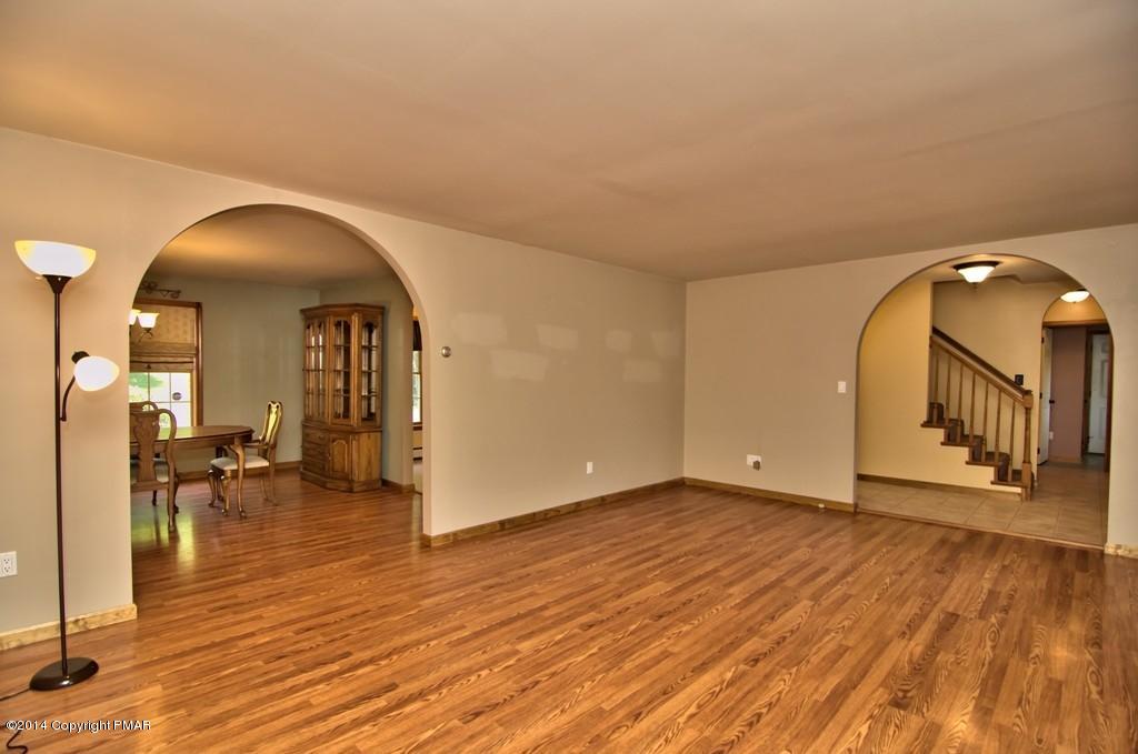 4161 Hickory Road Tobyhanna, PA 18466 - Photo 6 of 31 a view of a livingroom with wooden floor and furniture