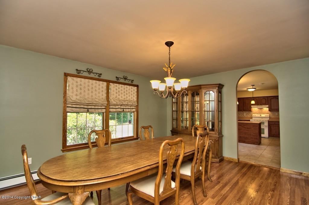 4161 Hickory Road Tobyhanna, PA 18466 - Photo 7 of 31 a view of a dining room with furniture wooden floor and chandelier
