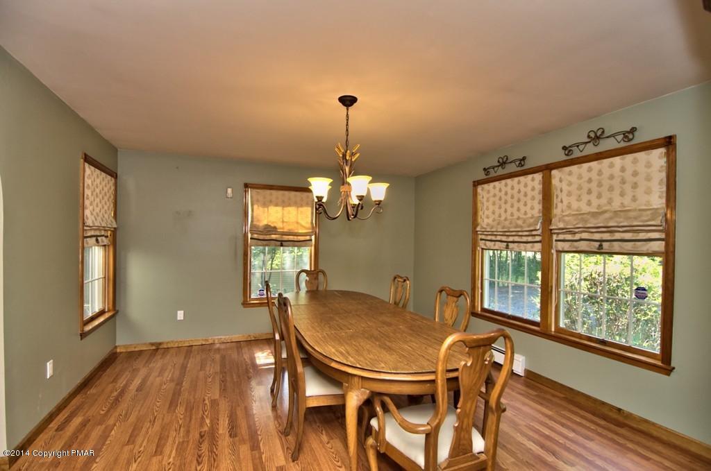 4161 Hickory Road Tobyhanna, PA 18466 - Photo 8 of 31 a view of a dining room with furniture window and wooden floor