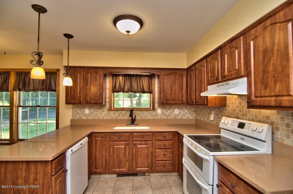 4161 Hickory Road Tobyhanna, PA 18466 - Photo 9 of 31 a kitchen that has a sink and a stove in it