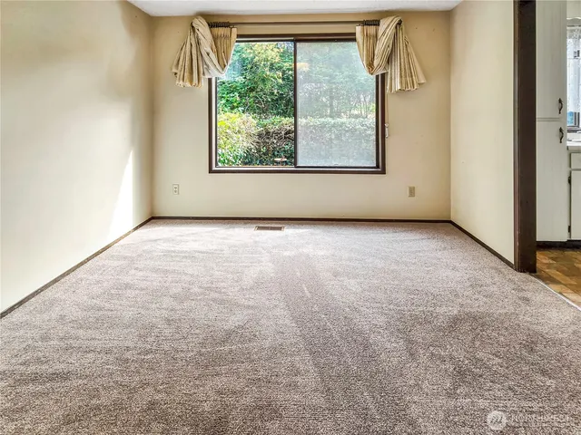 a view of an empty room and window