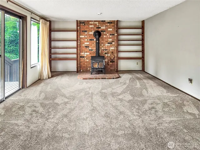 a view of balcony with wooden floor and outdoor seating