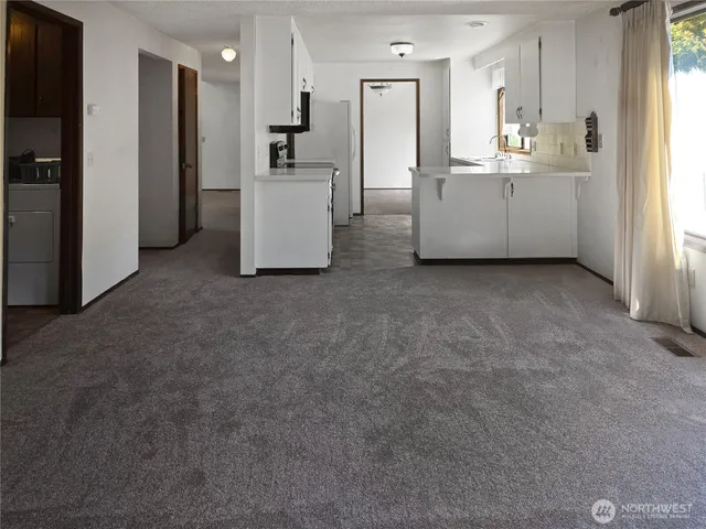 a kitchen with a sink a stove and refrigerator