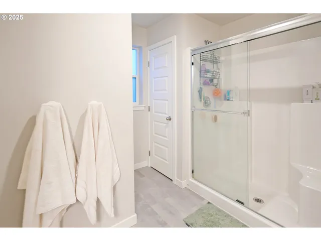 a bathroom with a shower and a tub