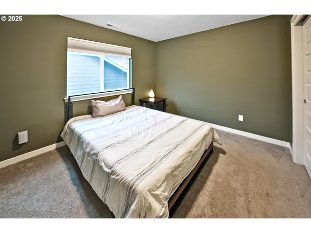 a bedroom with a bed and a cabinets