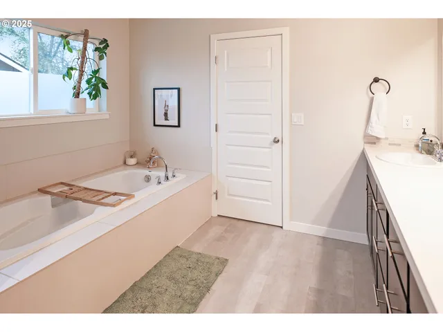 a kitchen with a stove a refrigerator and cabinets