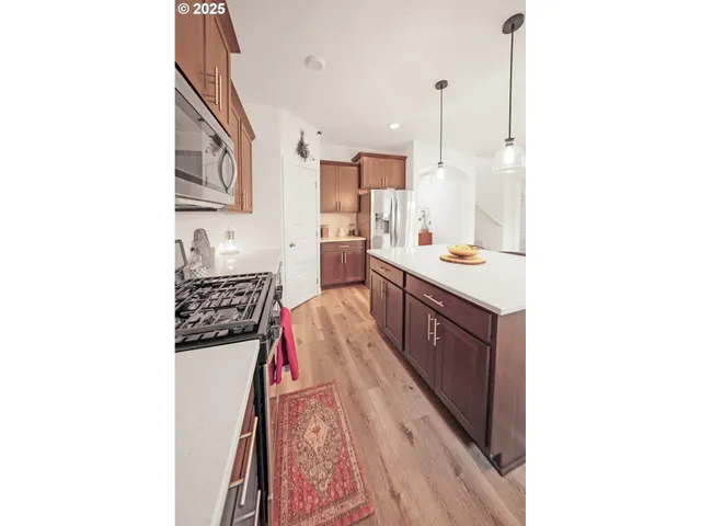 a spacious bathroom with a sink and a mirror