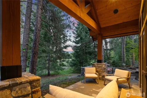 a view of a patio with a table chairs and a backyard