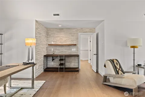 a bedroom with furniture and a fireplace