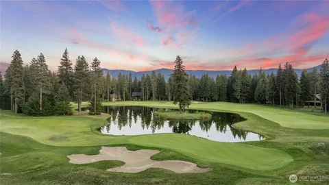 a view of a lake with a yard
