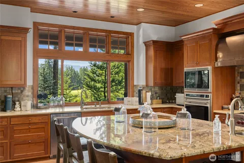 a view of a dining room with furniture window and outside view