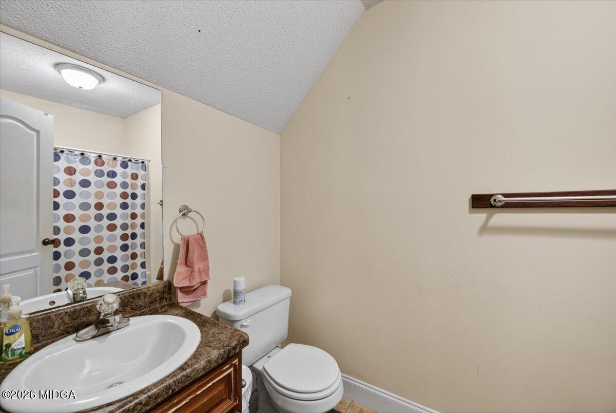 619 Grayridge Road Gray, GA 31032 - Photo 25 of 40 a white toilet sitting next to a bathroom sink