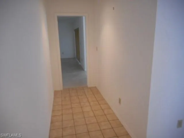 a view of an empty room and closet