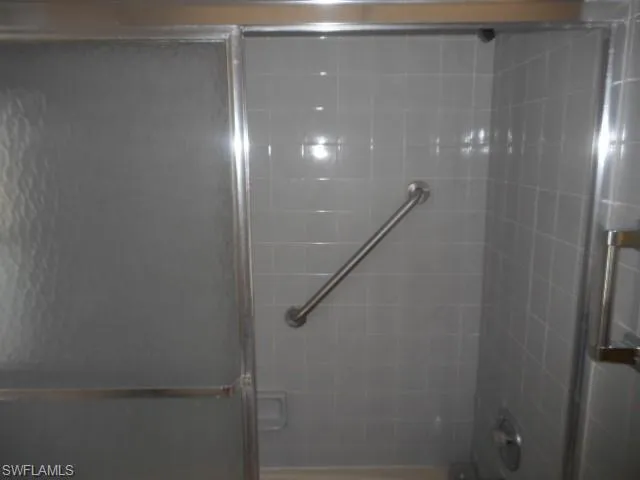 a view of an empty room and a window