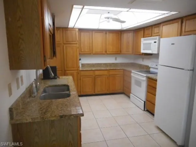 a kitchen with a refrigerator and cabinets