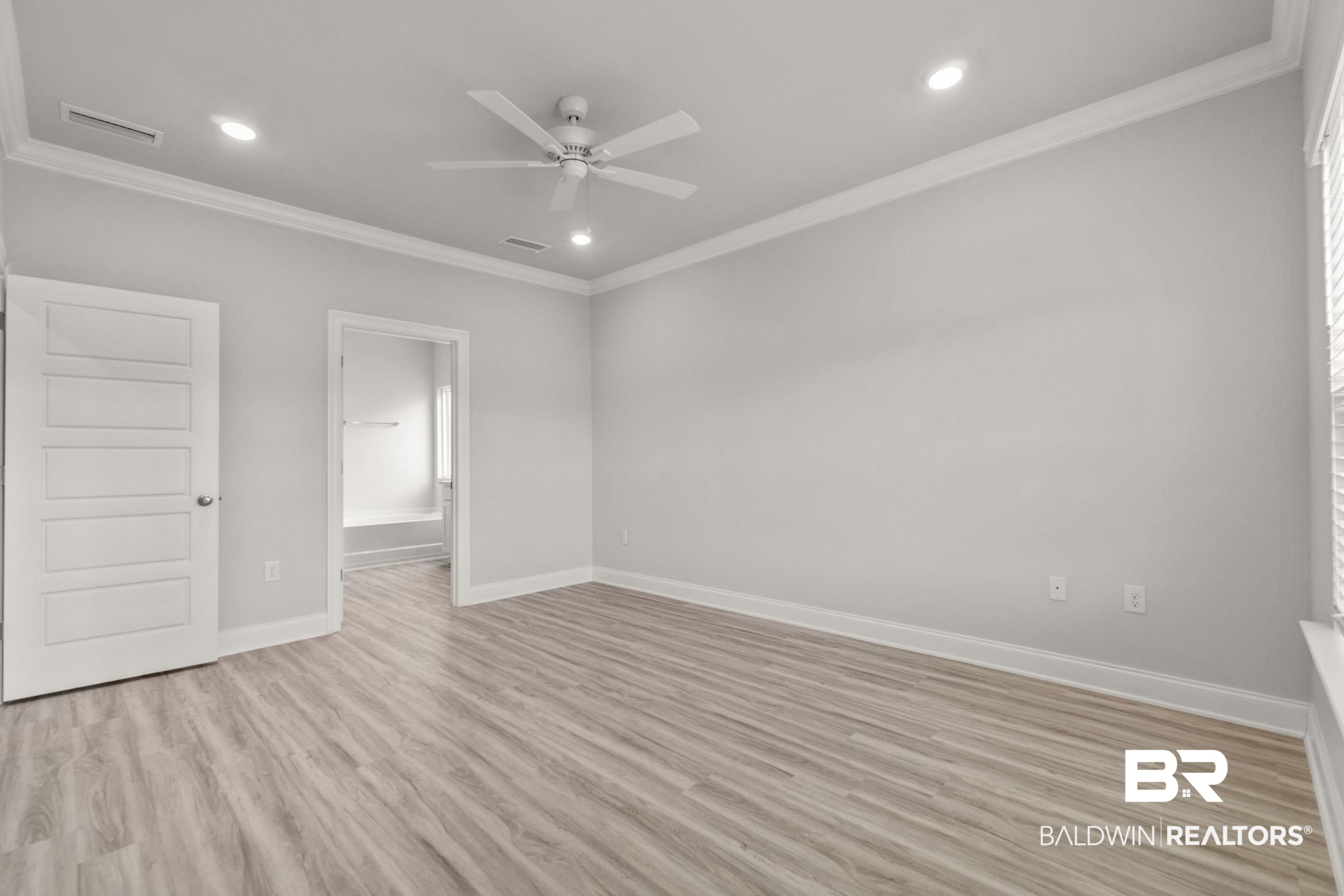 32125 Lyon Road Daphne, AL 36527 - Photo 12 of 70 Spacious room featuring light wood-finish flooring, recessed lighting, and a ceiling fan