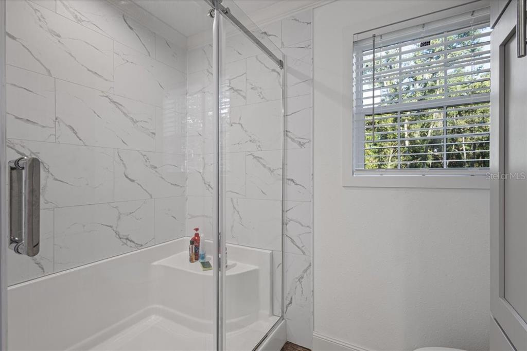 4654 Northwest 45th Avenue Bell, FL 32619 - Photo 18 of 52 a bathroom with a shower