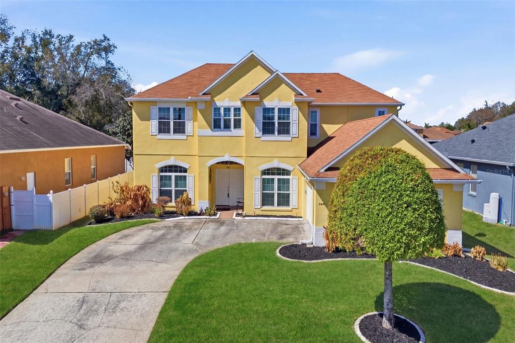 a front view of a house with a yard