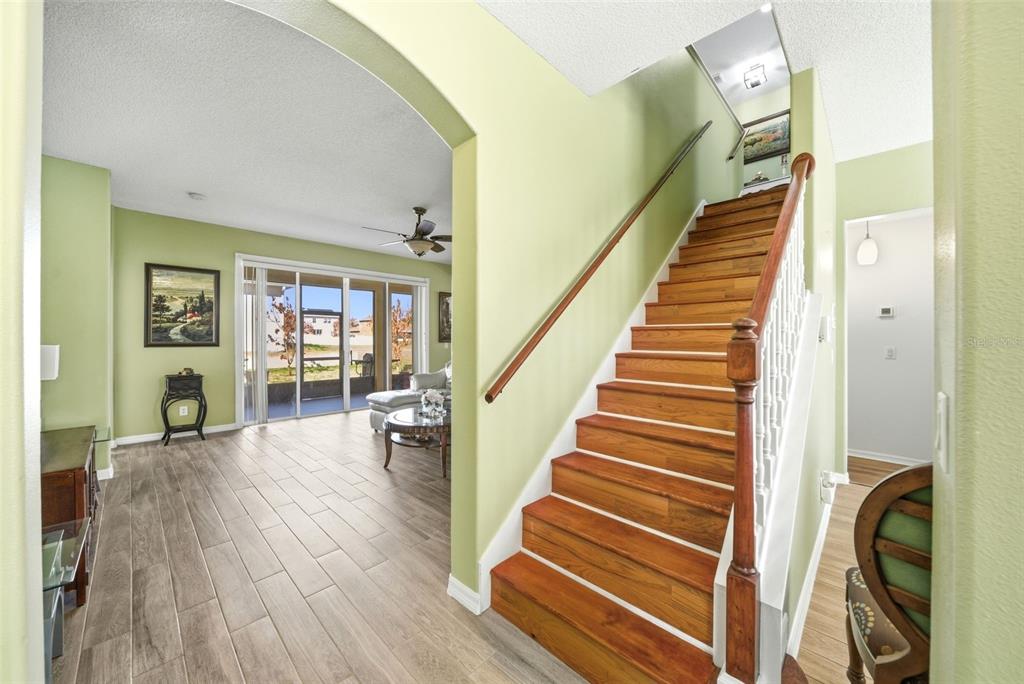 2614 Grapevine Crest Ocoee, FL 34761 - Photo 15 of 24 a view of entryway and hall with wooden floor