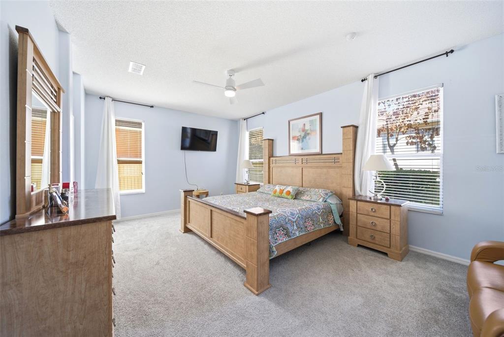 2614 Grapevine Crest Ocoee, FL 34761 - Photo 3 of 24 a bedroom with a bed lamp and window