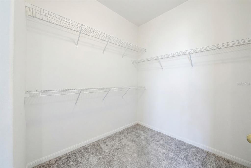 2614 Grapevine Crest Ocoee, FL 34761 - Photo 5 of 24 a view of a room with racks on the wall