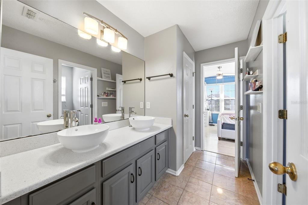 2614 Grapevine Crest Ocoee, FL 34761 - Photo 6 of 24 a bathroom with a double vanity sink mirror and double